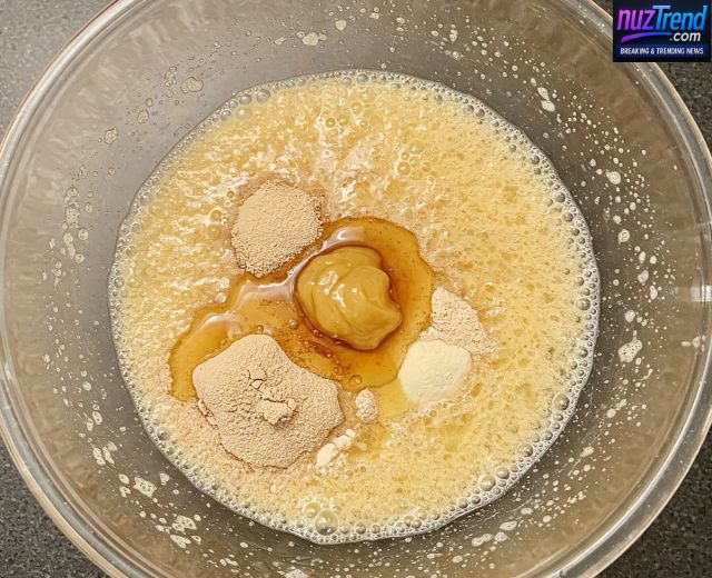 Yeast activating in warm water with honey in a bowl