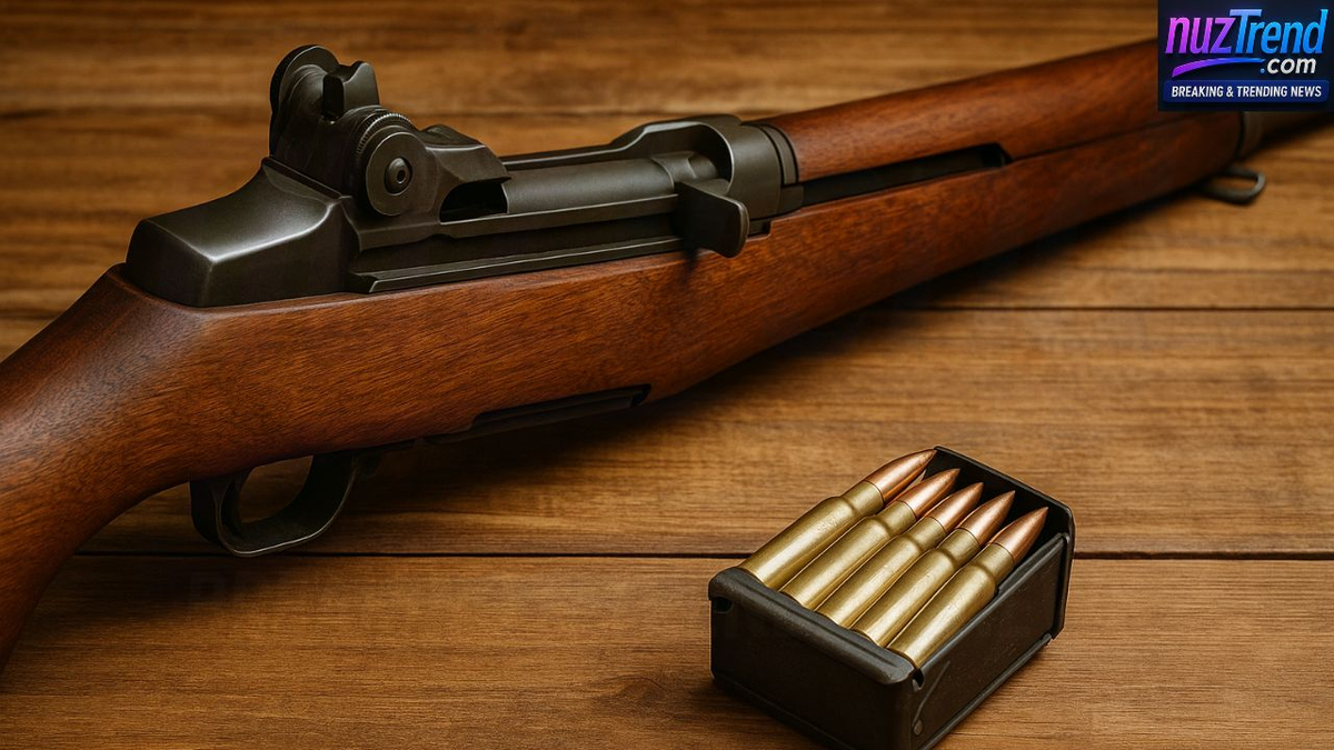 M1 Garand rifle and en-bloc clip with .30-06 cartridges on a wooden table