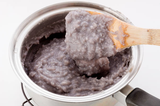 Mashing black beans and sweet potato