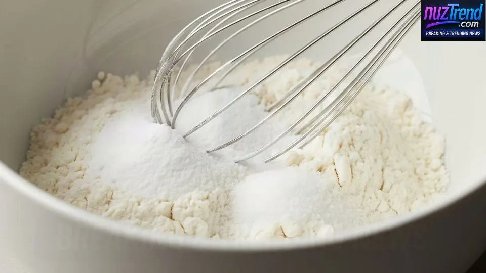 Mixing flour, baking soda, and salt