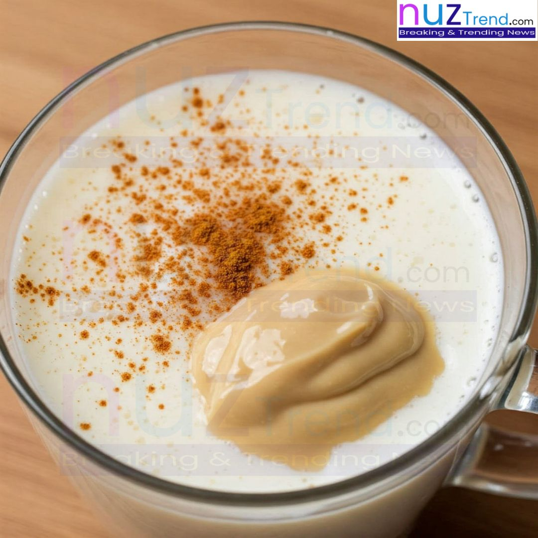 Pouring tahini latte into a cup for serving