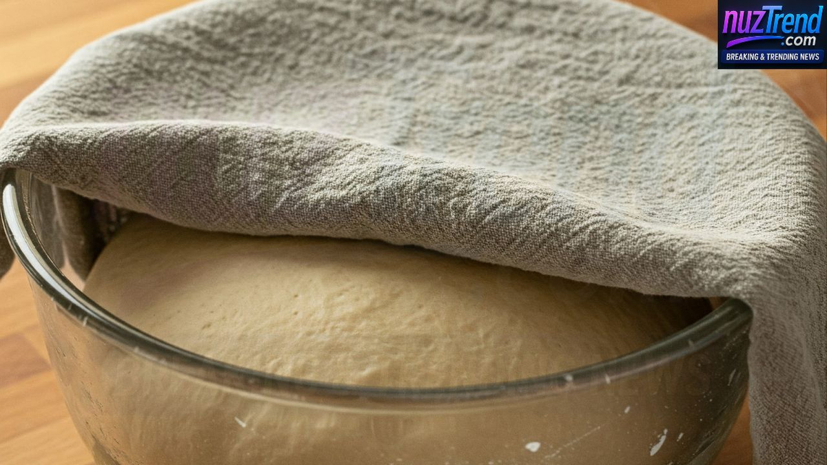 Loaf rising in pan before baking