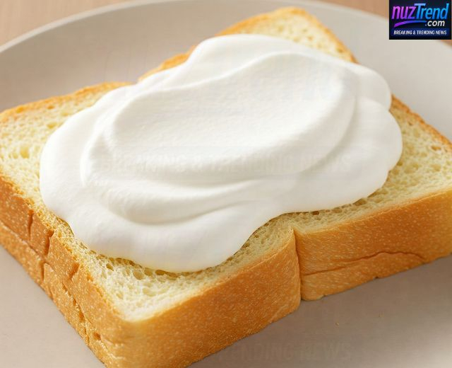 Spreading whipped cream on Japanese milk bread