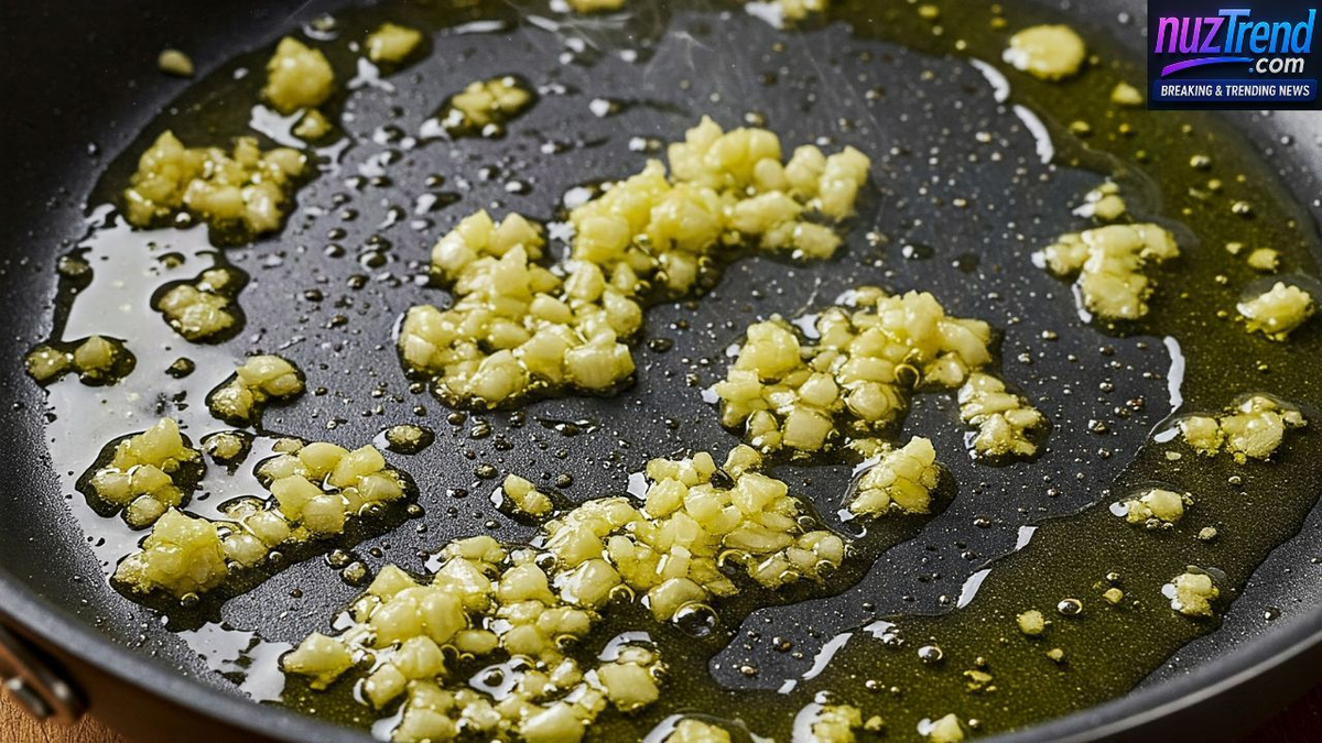 Garlic being sautéed in olive oil