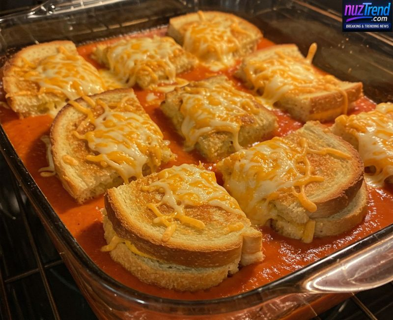 Layering tomato soup and grilled cheese in casserole dish