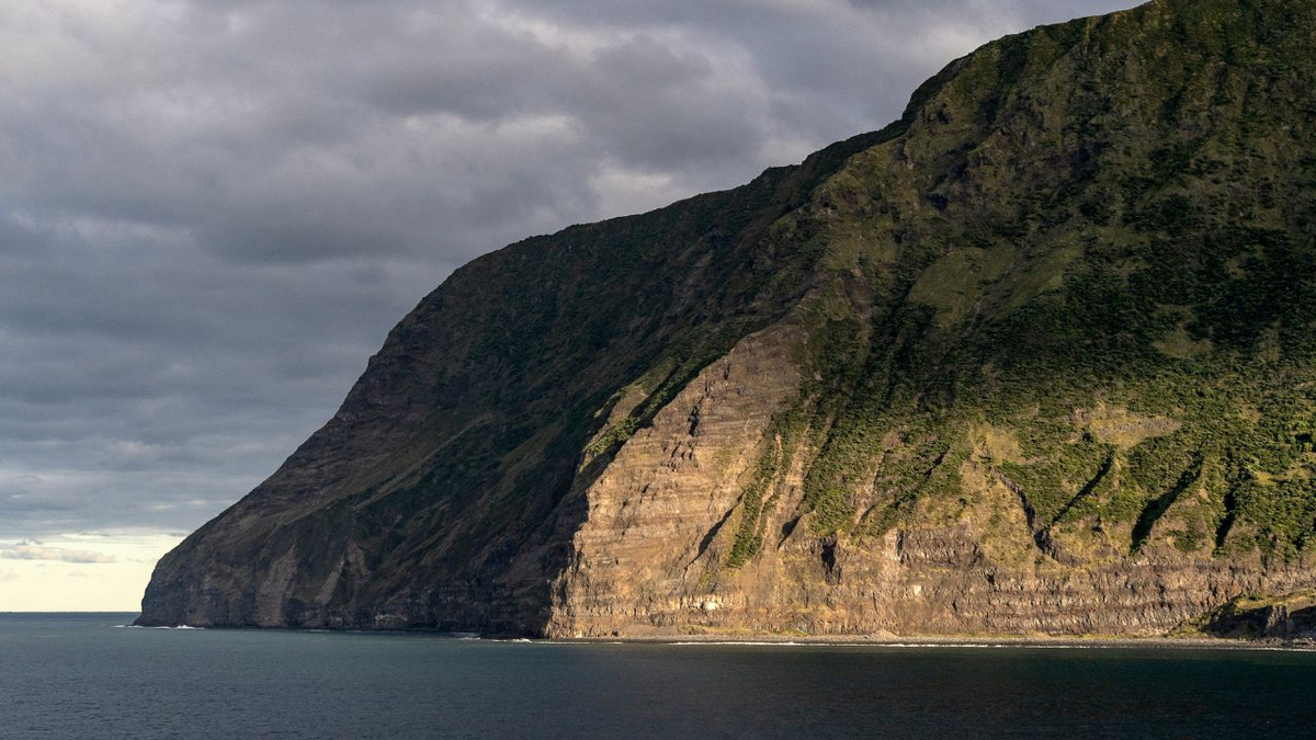 Side view of Tristan da Cunha island showing rugged cliffs and the South Atlantic Ocean